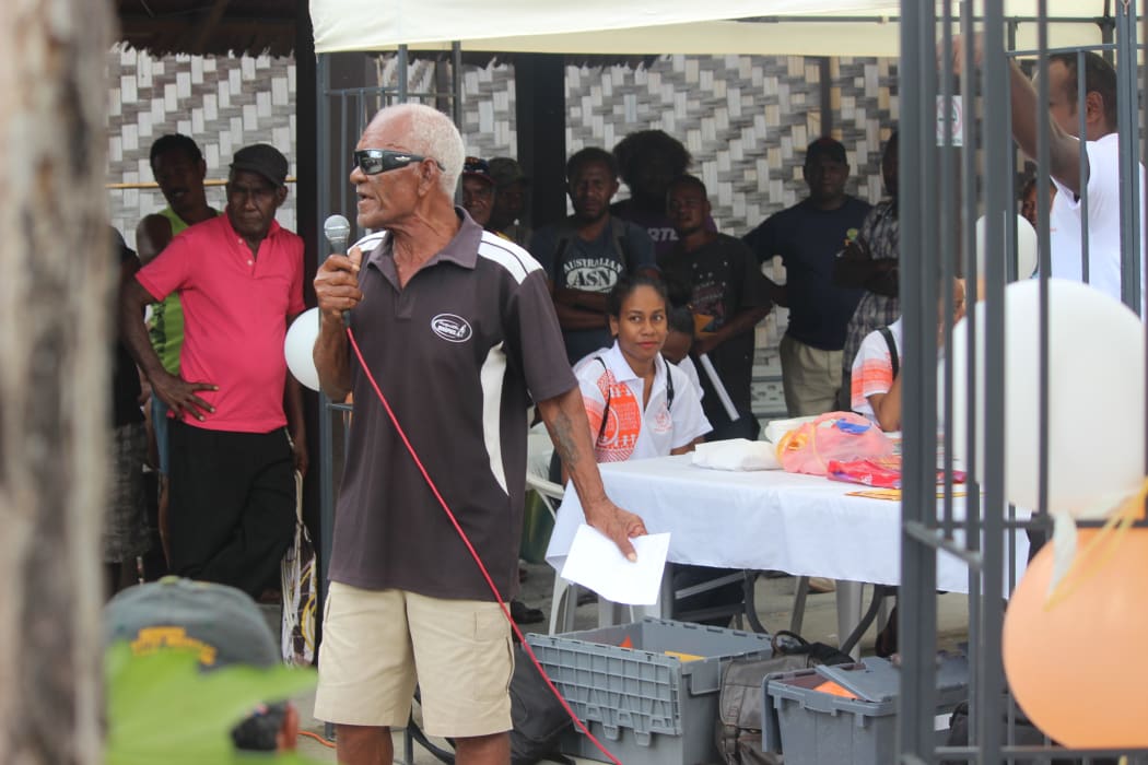 A voter in Honiara, Solomon Islands raises questions on the Voter Registration Update exercise carried out throughout the country from the third to the 27th of September.