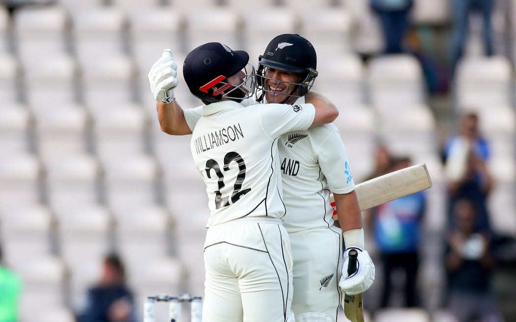 Ross Taylor (facing,right) and Kane Williamson hug after winning the World Test Championship final.