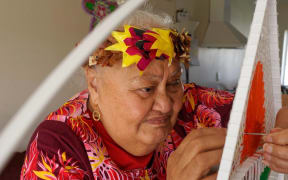 Lakiloko working on one of her art works.