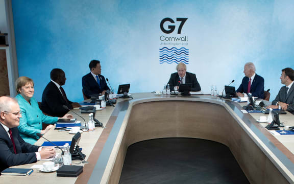 (L-R) Australia's Prime Minister Scott Morrison, Germany's Chancellor Angela Merkel,  Cyril Ramaphosa, South Korea's President Moon Jae-in, Boris Johnson, t Joe Biden and France's President Emmanuel Macront in Carbis Bay, Cornwall on June 12, 2021.