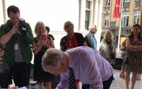 Auckland Mayor Phil Goff signing the Auckland Art Gallery Scroll