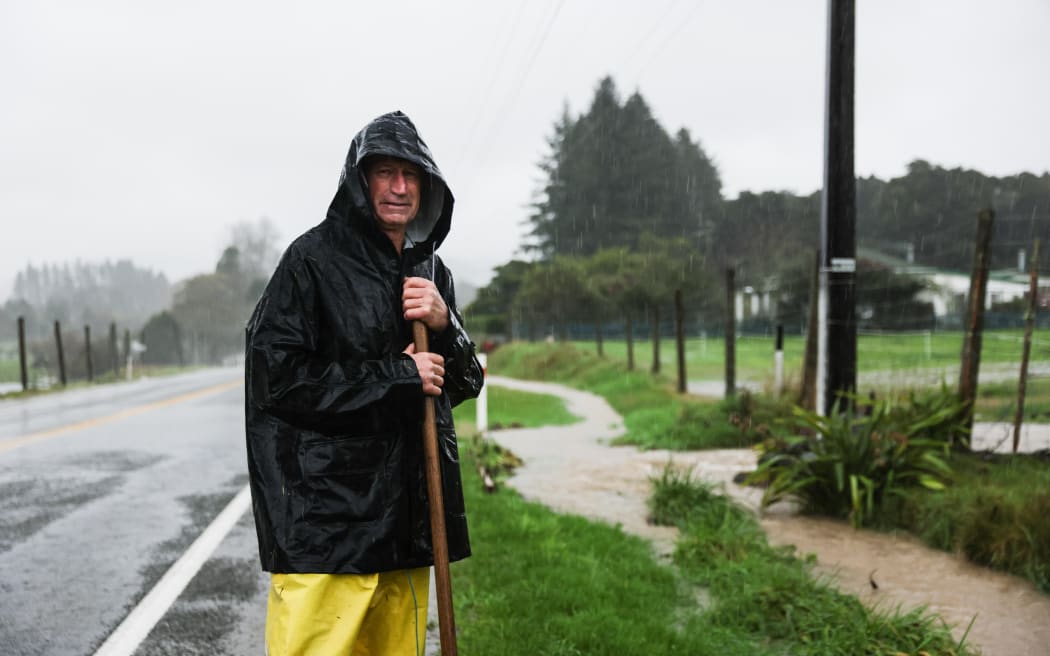 Foxhill resident Graeme Burbidge is diverting water to protect his property.