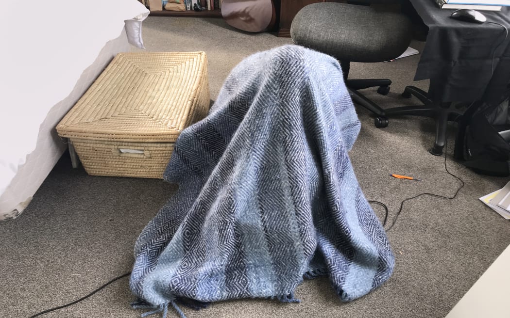 Kate Newton records under a blanket during the Covid-19 lockdown.
