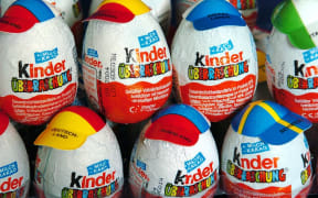 (dpa) - Rows of kinder surprise eggs are decorated with caps displaying different national flags on the occasion of this year's 28th Olympic Games in Potsdam, Germany, 30 March 2004.