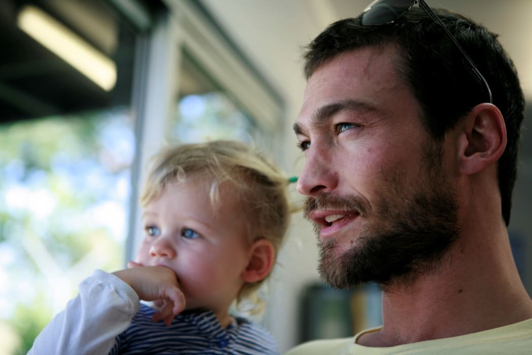 Andy Whitfield and child