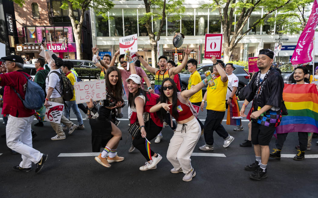 Participates march and wave to people along the roadside during the pride parade in Tokyo, 23 Apr. (Photo by Yusuke Harada/NurPhoto) (Photo by Yusuke Harada / NurPhoto / NurPhoto via AFP)
