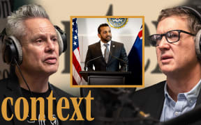 Guyon Espiner is wearing headphones positioned on the left of the image looking to the right. Corin Dann is wearing headphones on the right of the image looking towards the left. In the middle of the image is a yellow square featuring a photo of FBI Director Kash Patel. In the bottom left hand corner is the logo for the podcast series 'Context' in mustard yellow.