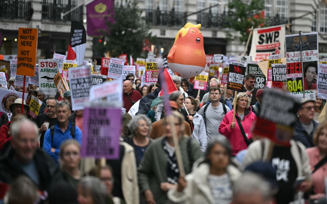 Anti-Trump protesters take part in a march during a demonstration against the second State Visit of US President Donald Trump in central London on 17 September, 2025.