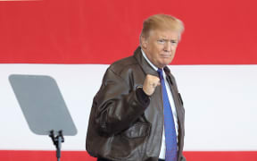 Donald Trump arrives at the US Yokota Air Base in Tokyo