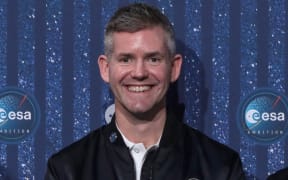 Britain's John McFall poses after being appointed the first astronaut recruit with a physical disability, during a ceremony to unveil the European Space Agency new class of career astronauts in Paris on November 23, 2022. - McFall works as a trauma and orthopaedic specialist in the south of England, and will join a separate "parastronaut" programme. His leg was amputated after a motorcycle accident at the age of 18 and he went on to represent the UK as a Paralympic sprinter. (Photo by Joël SAGET / AFP)