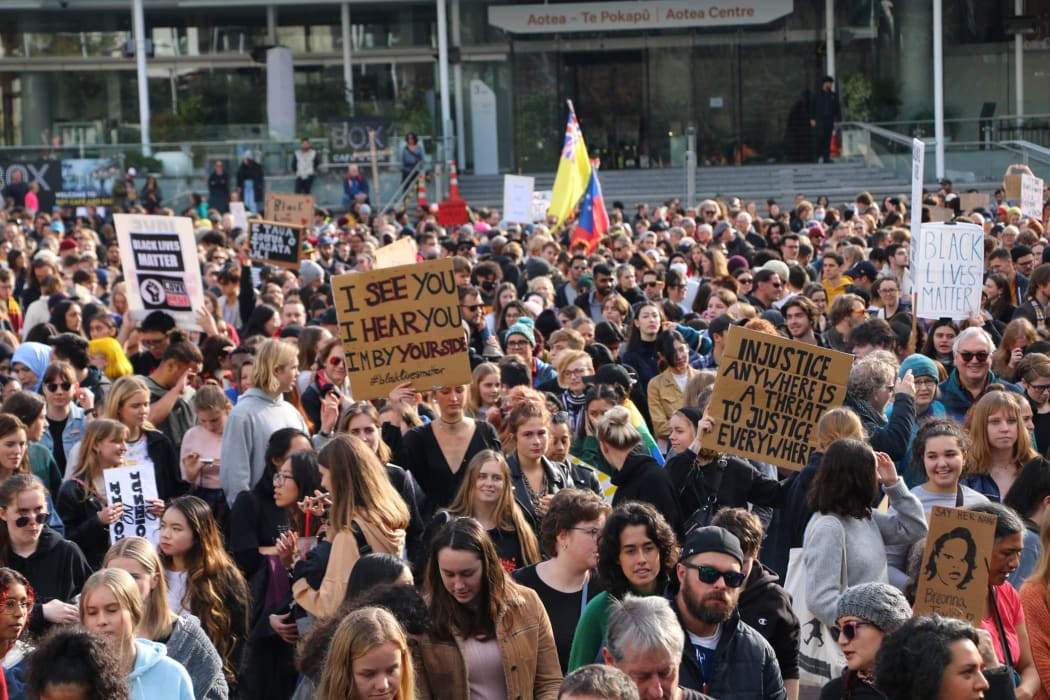 Protesters hold up their signs in Aotea Square, Auckland at the Black Lives Matter rally on 14 June, 2020.