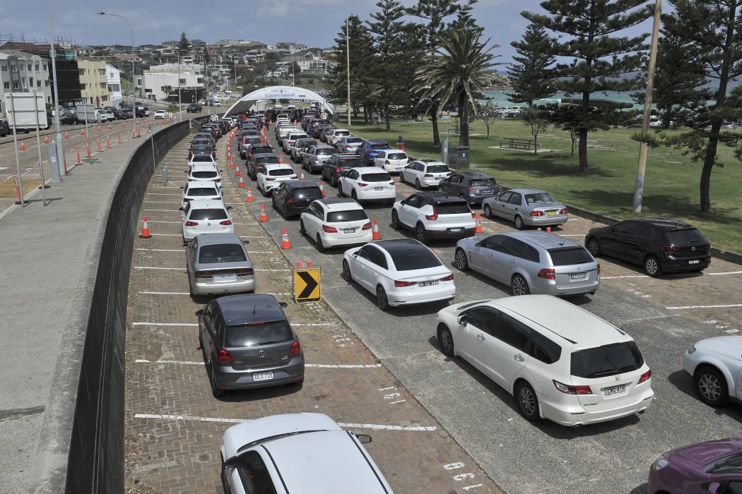 Residents queue up inside their cars for PCR tests at the St Vincent's Bondi Beach Covid-19 drive through testing clinic in Sydney.