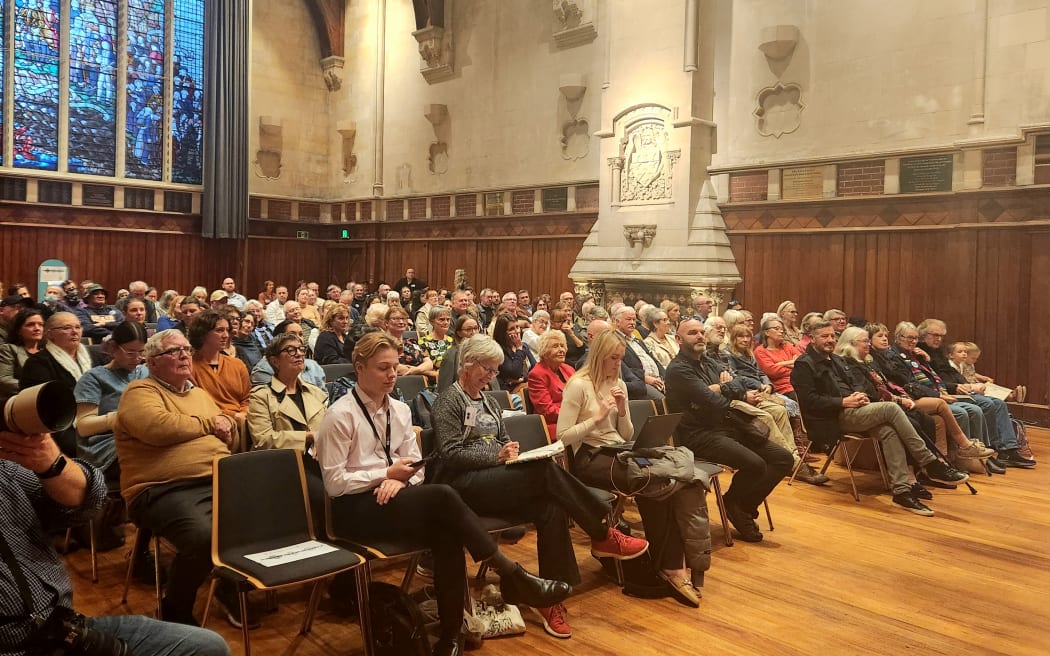 Packed public meeting at the Art Centre's Great Hall.