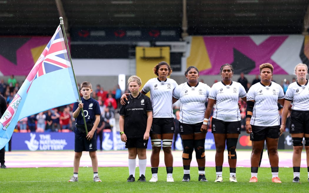(L-R) Alfreda Fisher, Loraini Senivutu, Bitila Tawake, Vika Matarugu and Jade Coates of Fiji line up for their national anthem prior to the Women's Rugby World Cup 2025 Pool B match between Scotland and Fiji at the Salford Community Stadium on 30 August, 2025 in Salford, England.