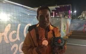 Morea Baru with his medal.