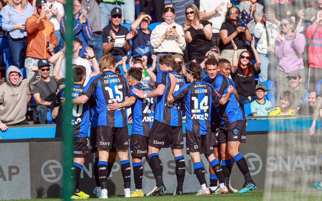 Auckland FC's Hiroki Sakai celebrates after Auckland go ahead following an own goal from a Brisbane defender.