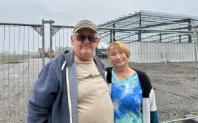 Dave McFarlane, left, and his partner Dorothy Lewis say the construction site near their property has been operating at all hours of the day.