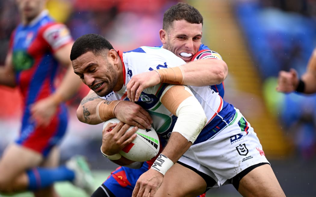 Marcelo Montoya of the Warriors is tackled by Adam Elliott of the Knights during the NRL Round 9 match between the Newcastle Knights and the New Zealand Warriors at McDonald Jones Stadium in Newcastle, Sunday, May 5, 2024. (AAP Image/Dan Himbrechts/www.photosport.nz) NO ARCHIVING, EDITORIAL USE ONLY
