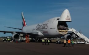 Emirates Team New Zealand's America's Cup catamaran about to be unloaded in Bermuda, where it will contest the cup next month.
