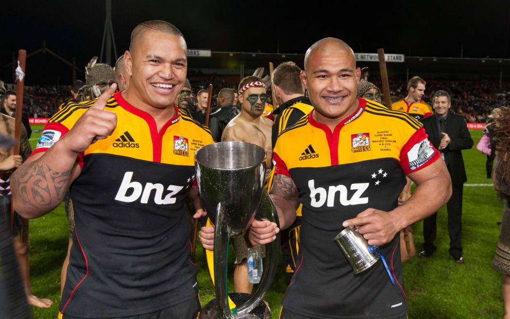 Hika Elliot and Sona Taumalolo celebrate with the Super Rugby trophy after Chiefs beat the Sharks in the 2012 final in Hamilton.
