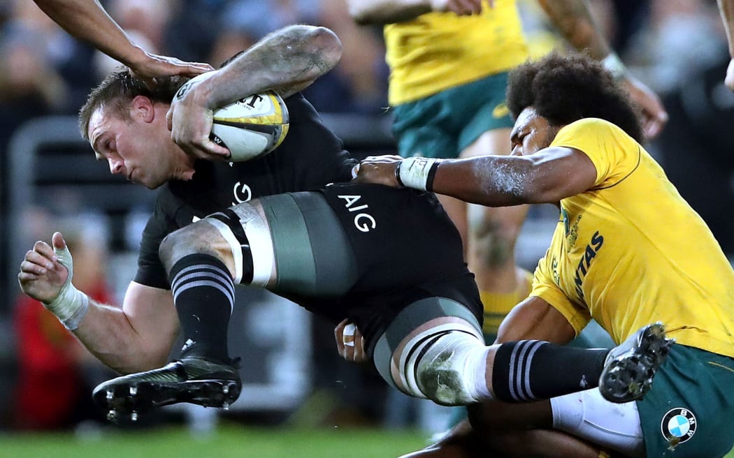 All Blacks flanker Liam Squire is tackled by Wallaby winger Henry Speight.