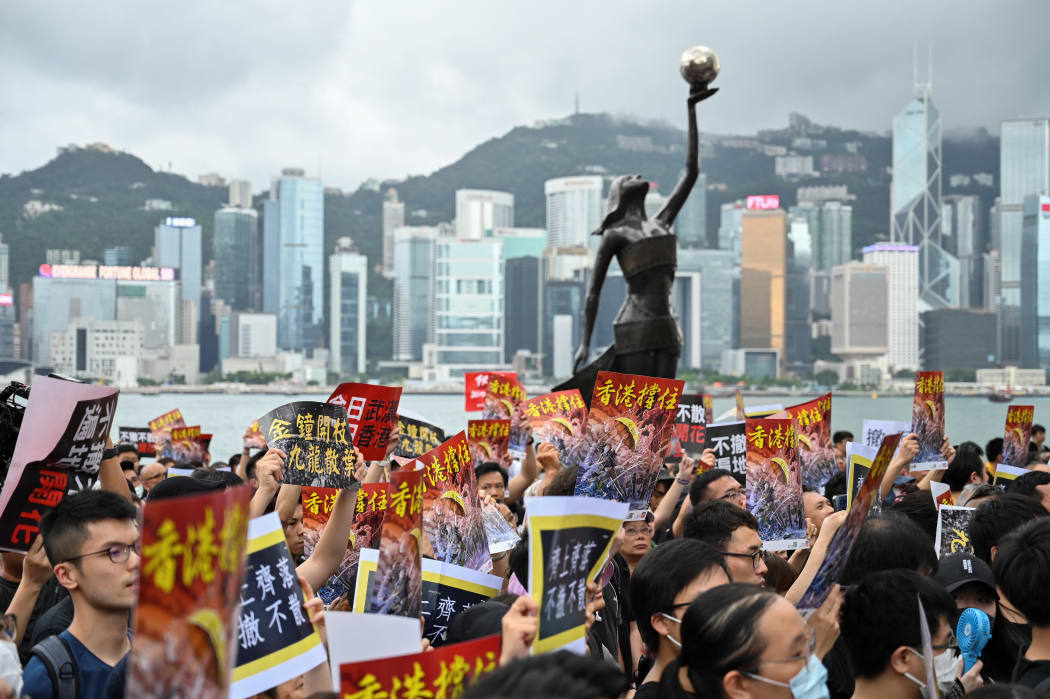 Protesters gather to take part in a march to the West Kowloon railway station, where high-speed trains depart for the Chinese mainland, during a demonstration against a proposed extradition bill in Hong Kong on July 7, 2019.