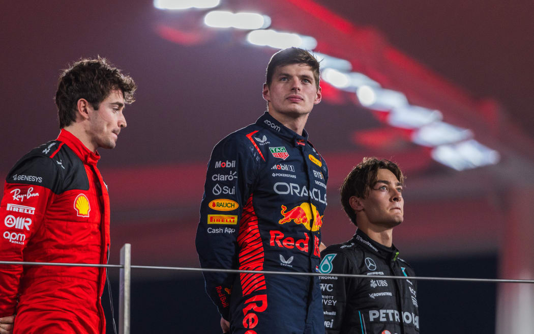 Max Verstappen, Charles Leclerc and George Russell on the podium during Formula One Abu Dhabi Grand Prix 2023.