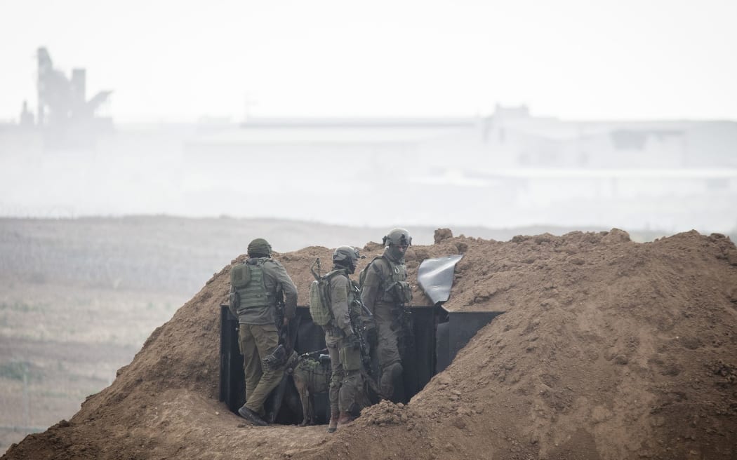 Soldiers of the Israeli forces taking positions during clashes with Palestinian protestors