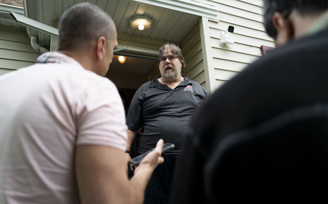 Daniel Carlson speaks to media about his roommate Vance Boelter, a suspect in the shooting of two Democratic-Farmer-Labor lawmakers, outside his home on June 14, 2025 in Minneapolis, Minnesota.