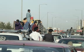 An Afghan family flee Kabul city, Afghanistan, on August 15, 2021.
