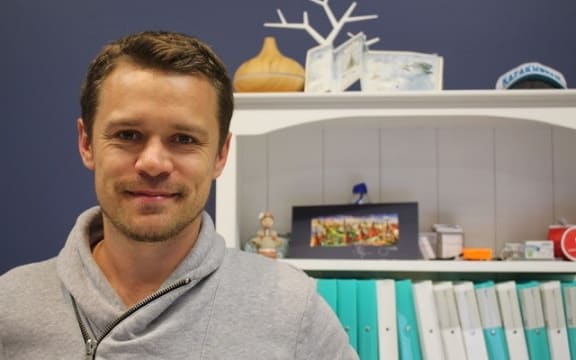 A portrait of Immigration consultant Dennis Vlasin.