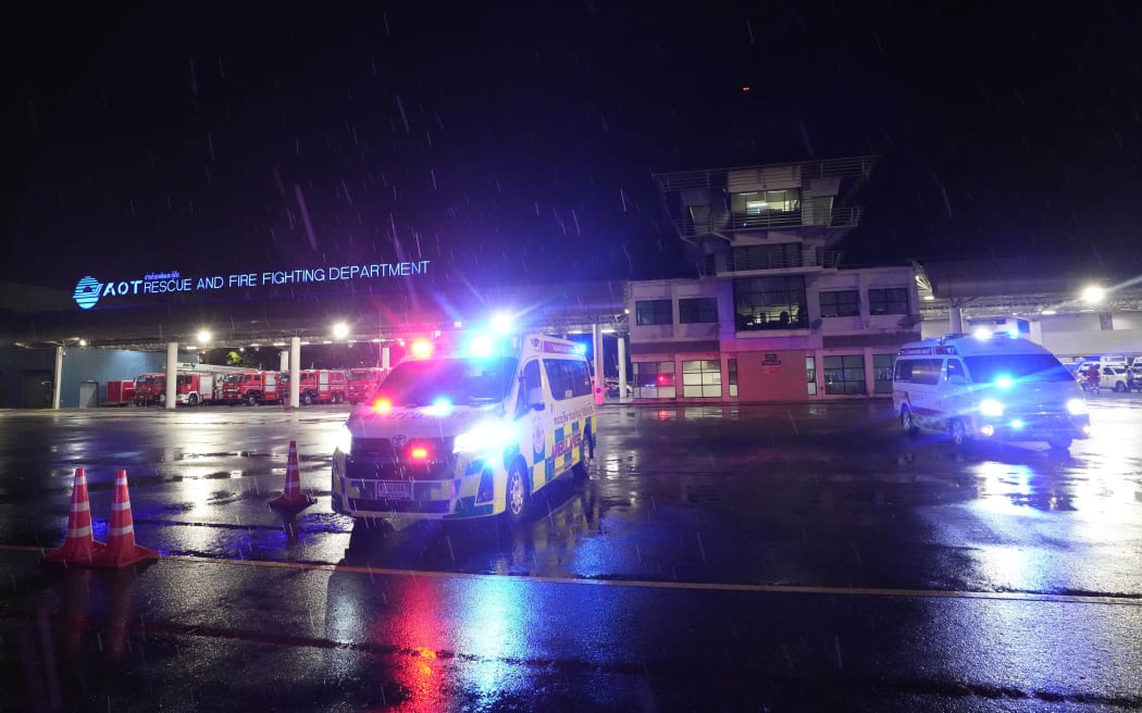 Ambulances are seen at the airport where a London-Singapore flight that encountered severe turbulence was diverted to, in Bangkok, Thailand, Tuesday, May 21, 2024. The plane apparently plummeted for a number of minutes before it was diverted to Bangkok, where emergency crews rushed to help injured passengers amid stormy weather, Singapore Airlines said Tuesday. (AP Photo/Sakchai Lalit)