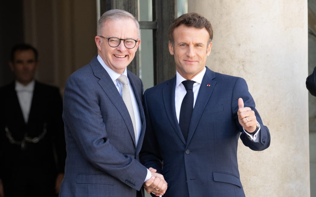 French President Emmanuel Macron shakes hands with Australian Prime Minister Anthony Albanese as he arrives at the Élysée Palace in Paris, France, 1 July 2022.