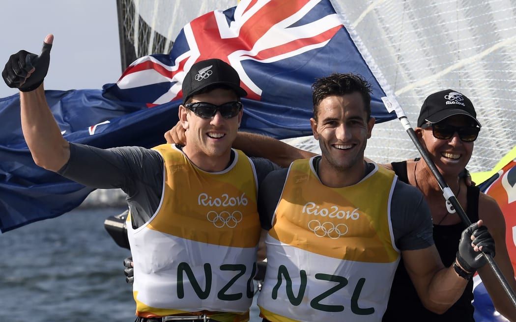 New Zealand sailors Peter Burling and Blair Tuke celebrate winning gold at the Rio Olympics.