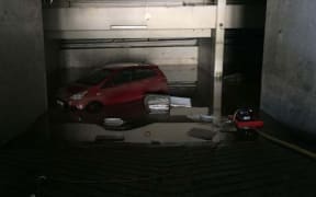A car was flooded after severe storms hit Tahiti.