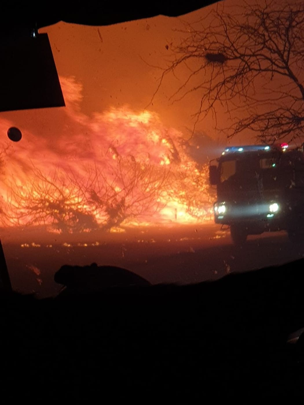 A fire truck near a blaze in Massie district, Queensland, about 200km inland from the Gold Coast, on 7 September.