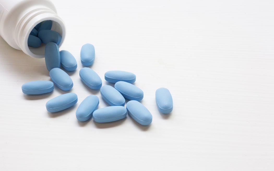 A bottle of "PrEP" ( Pre-Exposure Prophylaxis). used to prevent HIV, on white background.