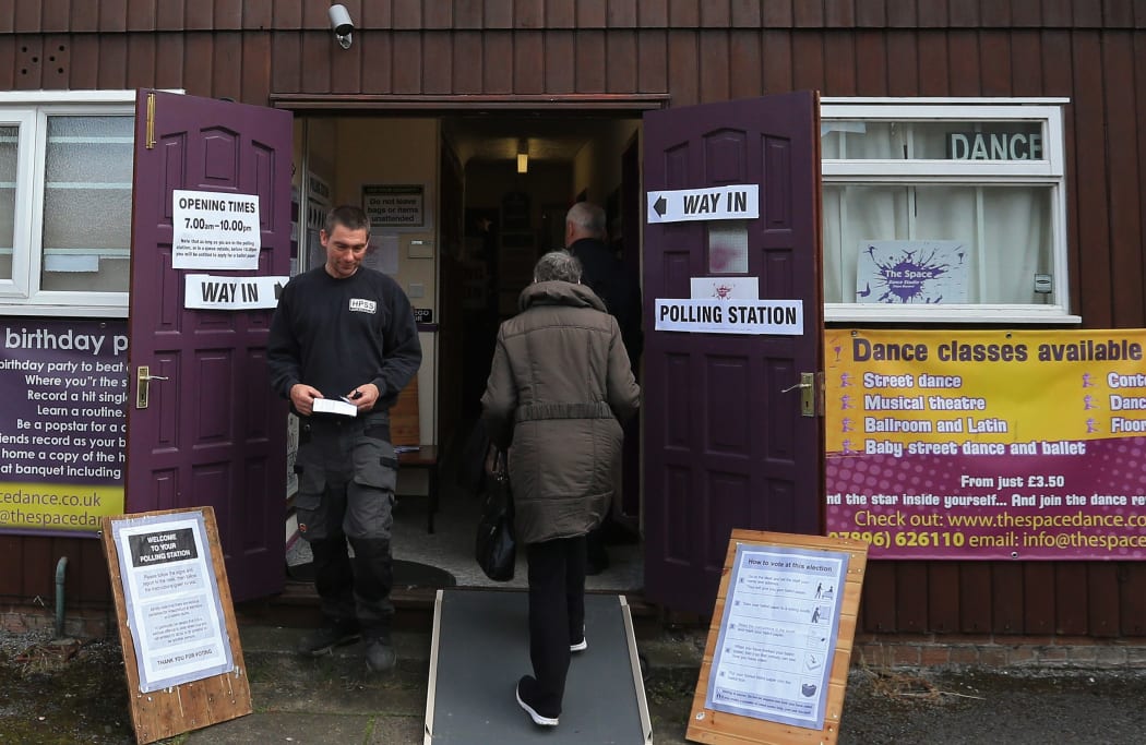 Voters head to a polling station in northern England.