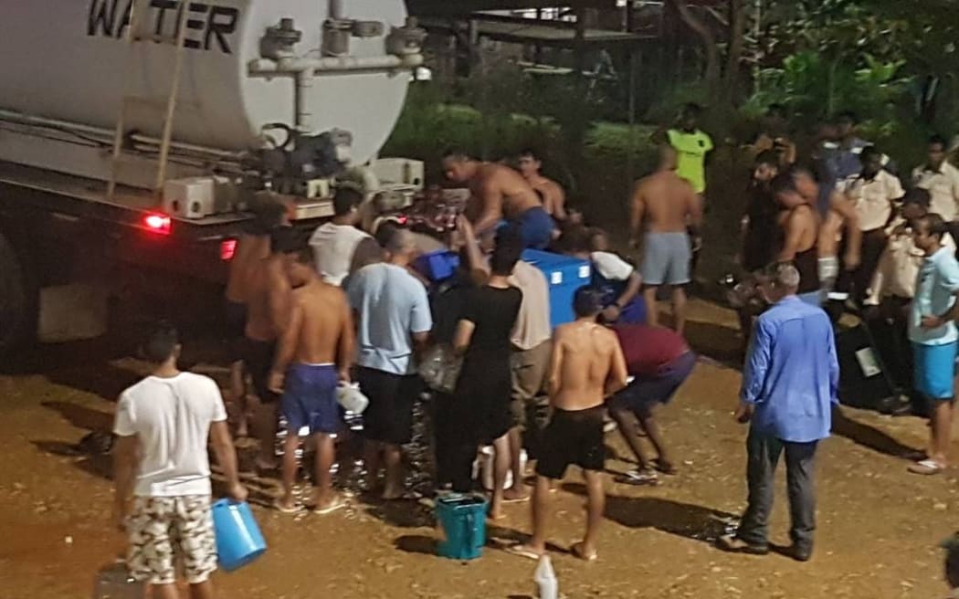 A tanker delivers water to refugees in the East Lorengau Transit Centre.