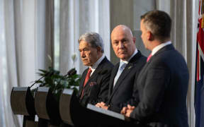 Coalition agreement signing ceremony between Christopher Luxon, David Seymour and Winston Peters.