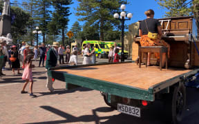 People dancing along to a piano tune by Marine Parade on Saturday to celebrate art deco without the festival.