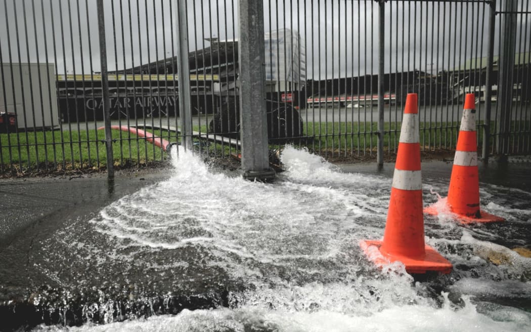 Water is pumped out of Auckland's Eden Park after severe rainfall flooded the grounds.
