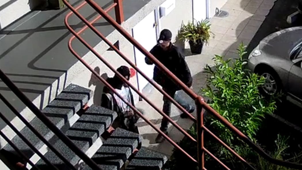 Two teenagers entering motel on CCTV footage