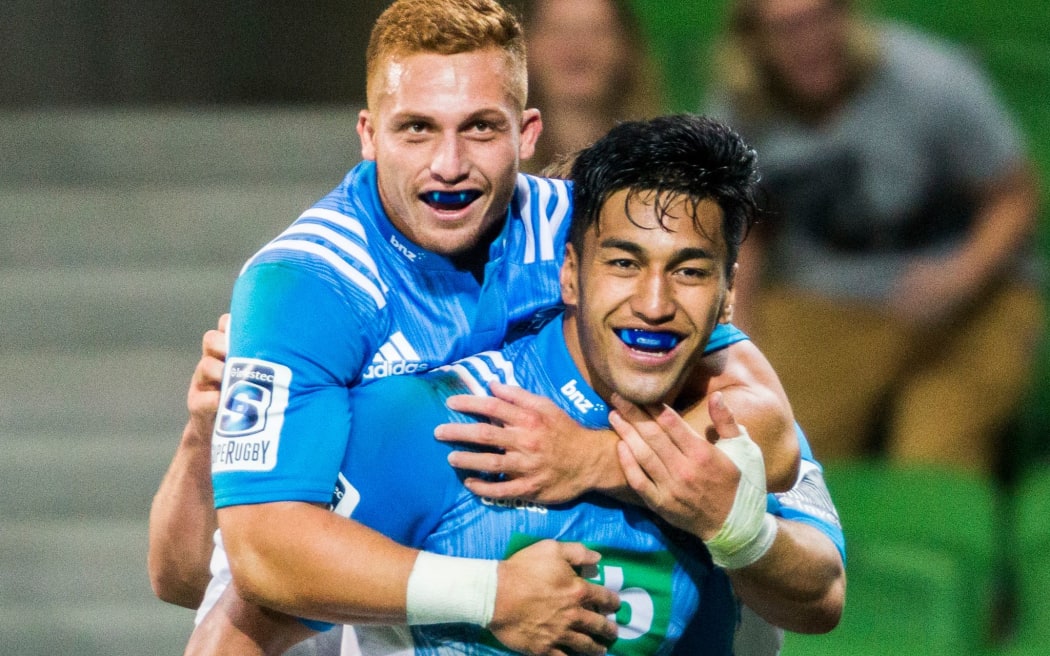 Reiko Ioane and Ihaia West celebrate one of Ioane's three tries.