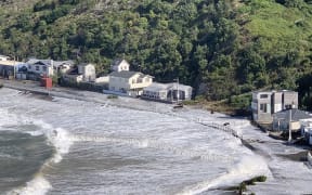 Massive waves wash over Ōwhiro Bay.