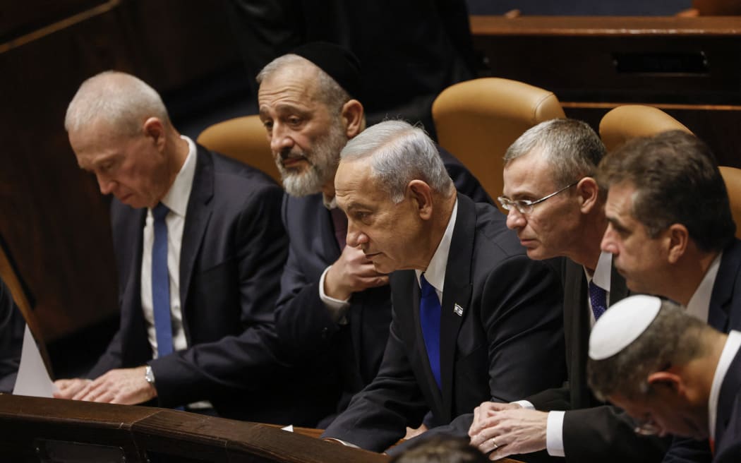 Israel's Prime Minister Benjamin Netanyahu and members of his new cabinet look on during the government's swearing in session at the Knesset in Jerusalem.