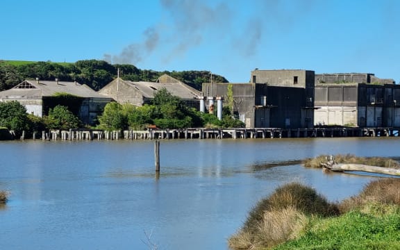 Derelict coolstores buildings on the banks of the Pātea River in Taranaki.