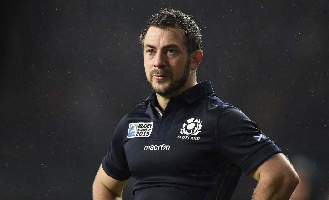 Scotland's halfback and captain Greig Laidlaw reacts after losing their quarter-final match against Australia at Twickenham, on October 18, 2015. AFP PHOTO / MARTIN BUREAU