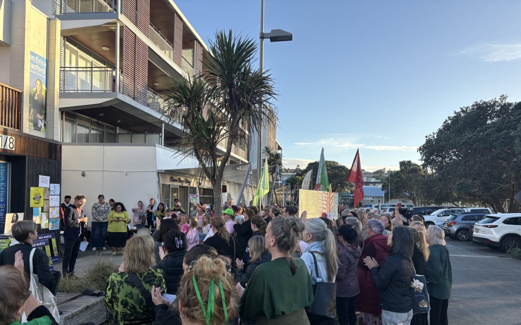 School staff gathering outside Education Minster Erica Stanford’s office in Browns Bay, Auckland.