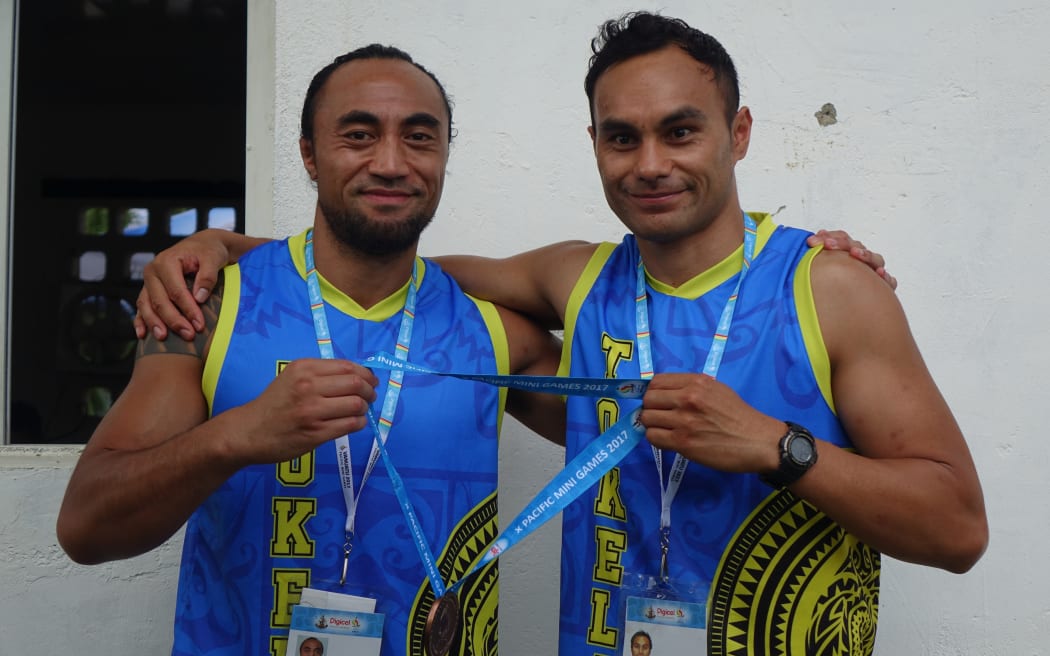 Ilai Elekana Manu and Peter Elekana show off Tokelau's silverware at the Pacific Mini Games in Vanuatu.
